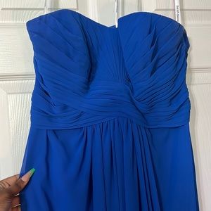 A Blue dress. It’s strapless. It’s flowy. Only worn 1 time!